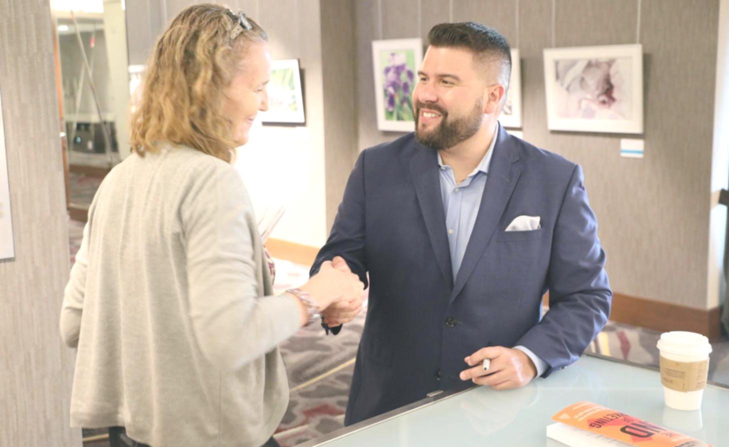 Financial analyst working on valuation models with multiple screens showing market data and financial statements